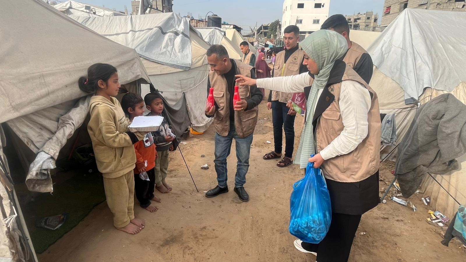 Children receiving their hot iftar meals